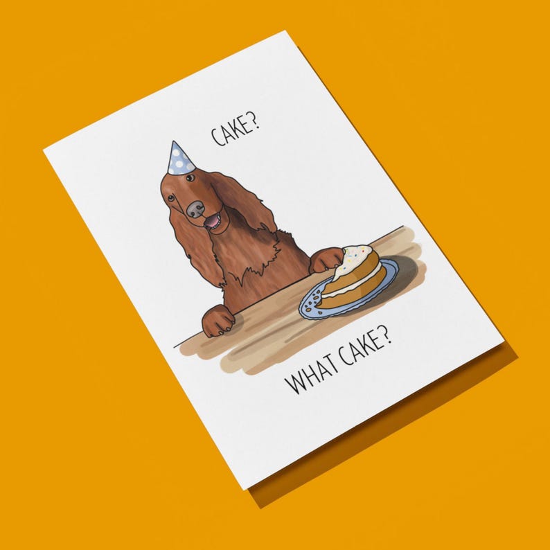 Puede incluir: Una tarjeta de cumplea&ntilde;os con una ilustraci&oacute;n de dibujos animados de un perro marr&oacute;n con un gorro de fiesta azul, mirando una porci&oacute;n de pastel en un plato. El texto de la tarjeta dice "Cake? What cake?"