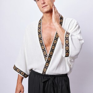 Africano-inspired men’s kimono jacket, perfect for beachwear, festivals, and casual outings. Bold, unique design made from natural fabrics. Lightweight, breathable, and ideal for warm weather. Stand out with this retro-style piece.