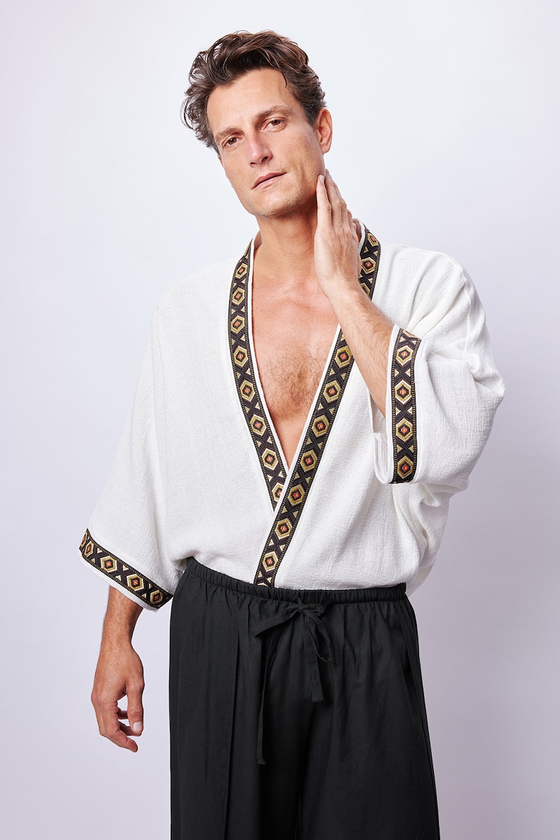 Africano-inspired men’s kimono jacket, perfect for beachwear, festivals, and casual outings. Bold, unique design made from natural fabrics. Lightweight, breathable, and ideal for warm weather. Stand out with this retro-style piece.