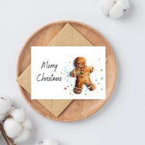 Cartões de felicitações de feliz Natal em aquarela com boneco de gengibre