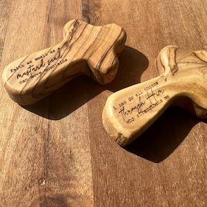 May include: Two wooden crosses with engraved inspirational quotes. The first cross reads "Faith as small as a mustard seed can move mountains." The second cross reads "I can do all things through Him who strengthens me."