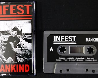 May include: A black cassette tape with the band name "INFEST" and the album title "MANKIND" printed on the front. The cassette tape is in a clear plastic case.