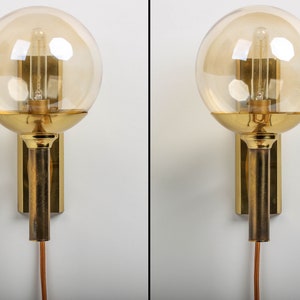 A pair of brass wall lamp by Svend Mejlstroem, Norway. Mid Century moden design