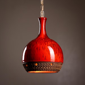 A vintage lustrous ceramic stoneware pendant lamp made in Denmark MCM Danish design.