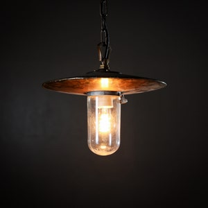 A unique one of a kind vintage French industrial pendant lamp in brass and glass