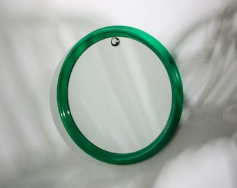 H 31 cm / 12 in. Round vintage mirror in a frame of lacquered solid wood, Luxus, designed by Uno and Östen Kristiansson in the 1960s.