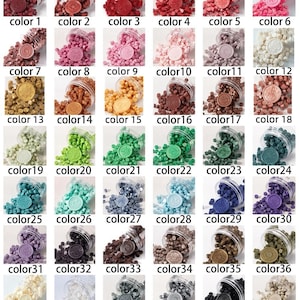 May include: Forty-two small jars of wax beads in various colours, including red, pink, green, blue, purple, brown, and white. Each jar has a small round wax seal on top.
