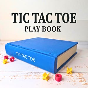 May include: A blue book-shaped game case with the text TIC TAC TOE on the spine. The case is accompanied by small yellow X-shaped game pieces and small red O-shaped game pieces. The text TIC TAC TOE PLAY BOOK is displayed above the game case.