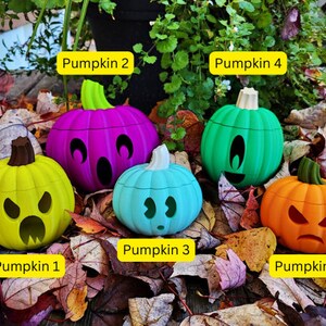 May include: Five Halloween-themed pumpkins with different facial expressions. The pumpkins are painted in various colors, including green, purple, yellow, blue, and orange. The pumpkins are labeled with numbers 1 through 5.