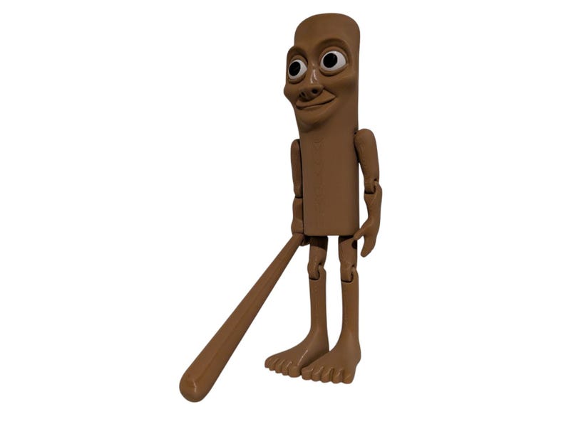 May include: A brown, articulated figure with a cylindrical body, a smiling face, and large eyes. The figure holds a brown, elongated object resembling a baseball bat. The figure has articulated arms and legs and is standing on a white background.