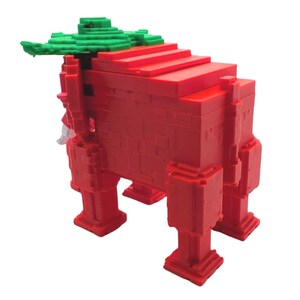 May include: A red, geometric, box-like sculpture with a green, leafy top. The sculpture has a stepped design on top and is supported by four square legs. The overall design is reminiscent of a stylized animal or creature.