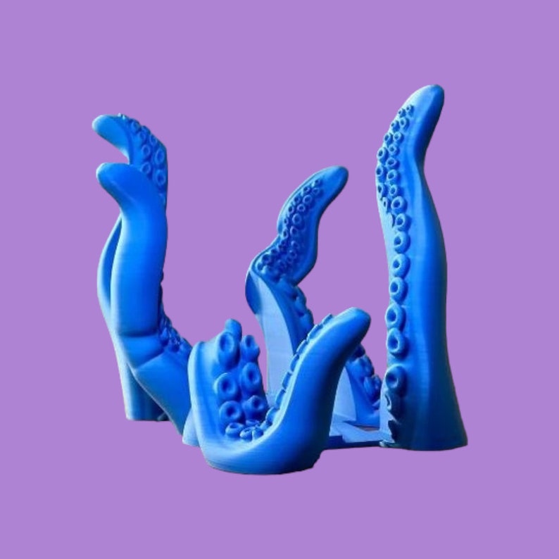 May include: A blue 3D printed octopus tentacle sculpture with multiple arms reaching upwards. The sculpture is made of a smooth, glossy material.