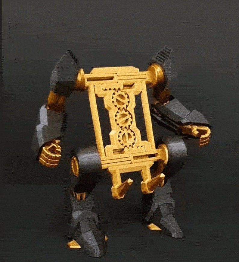 May include: A gold and black robot with a gear-shaped body and articulated limbs. The robot is standing on a black surface.
