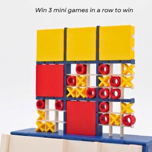 May include: A multi-level tic-tac-toe game board featuring a blue frame, yellow and red solid square tiles, and small red O and yellow X game pieces. The text Win 3 mini games in a row to win is displayed above the board, which has a grid structure.