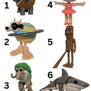 May include: A collection of six whimsical figurines. The figurines include an elephant, a cow with a planet body, a tree-like creature, a ballerina, a stick figure, and a shark wearing blue sneakers. Each figure has a unique design and pose.