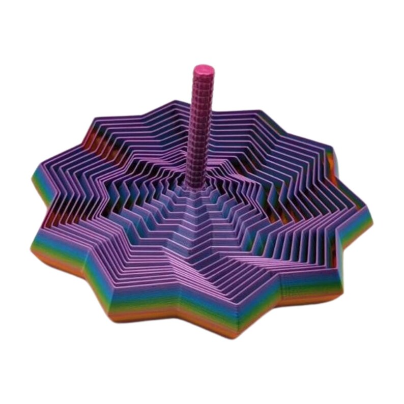 May include: A colorful, star-shaped toy with a central pink post. The toy features layers of purple, blue, green, orange, and yellow, creating a rainbow effect. The design is geometric and layered, with a textured post.
