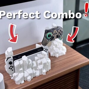 May include: White 3D printed stand with a rocky design holding a Nintendo Switch console and a green and black Xbox controller. The text "Perfect Combo!" is written above the stand.