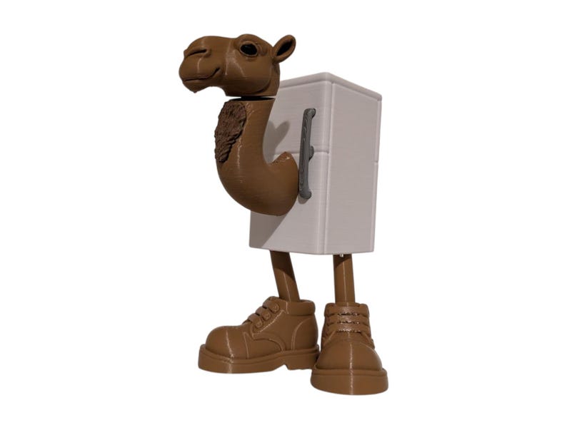 May include: A whimsical figurine of a camel with a refrigerator body, brown legs, and brown boots. The camel's head and neck are brown, and the refrigerator is white with a gray handle. A unique decorative item.