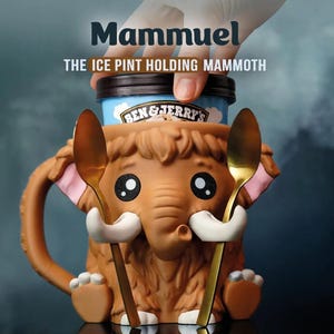 May include: A brown ceramic ice cream pint holder shaped like a cartoon mammoth, with a blue and brown ice cream container inside. The holder has a handle and holds two gold spoons. Text on the holder reads "Mammuel THE ICE PINT HOLDING MAMMOTH."