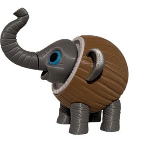 May include: A whimsical 3D-printed elephant figurine. The elephant has a gray head, trunk, and legs, with blue eyes and a brown, textured body. The trunk is curved upwards, and the ears are silver.
