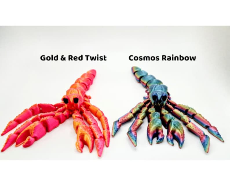 Puede incluir: Dos figuritas de escorpi&oacute;n impresas en 3D. Una es de color rosa brillante y naranja con el texto "Gold & Red Twist". La otra es un escorpi&oacute;n iridiscente multicolor con el texto "Cosmos Rainbow".