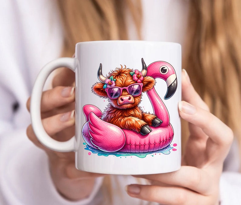 May include: White ceramic mug with a colorful illustration of a Highland cow wearing sunglasses and a flower crown, floating on a pink flamingo pool float.