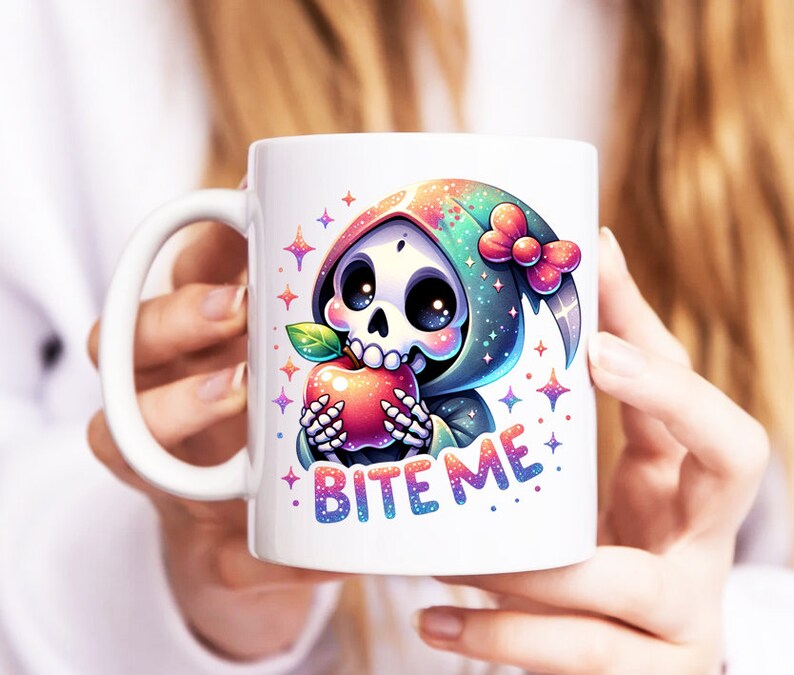 May include: White ceramic mug with a colorful illustration of a cartoon skeleton wearing a green hooded robe and holding a red apple. The text "Bite Me" is printed on the mug.