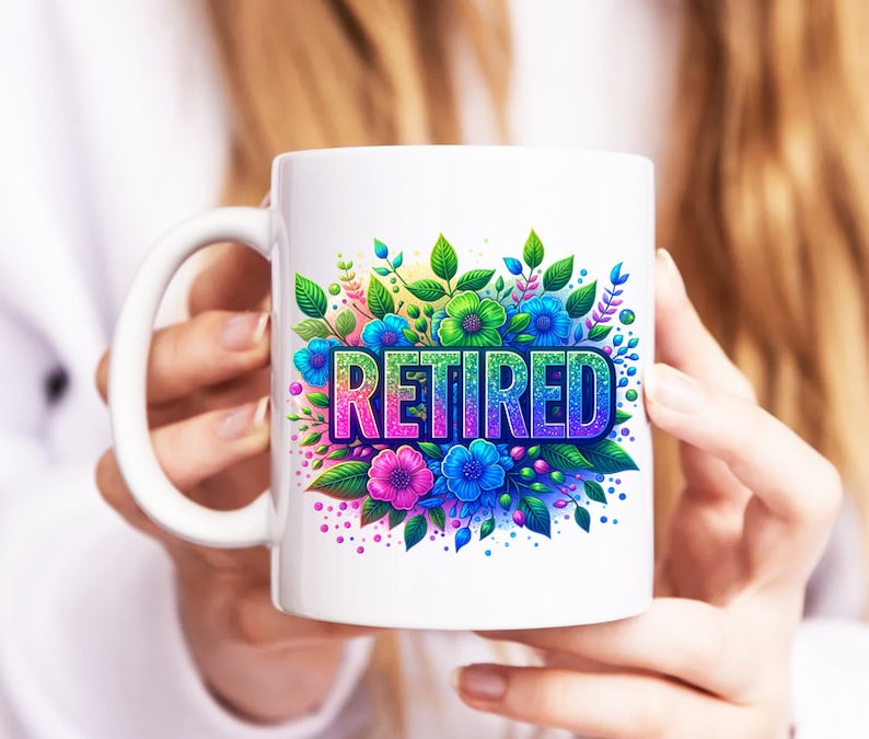 May include: White ceramic mug featuring a colourful floral design and the word "Retired" in rainbow glitter letters.