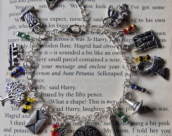 Silver Harry wizard school houses themed H.P wizard charm bracelet.