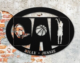 May include: Black metal oval sign with the word "DAD" in large letters. The "A" is a basketball and the "D" is a basketball hoop. A basketball player is silhouetted in the "D". The sign has the names "BILLY" and "JESSIE" at the bottom.