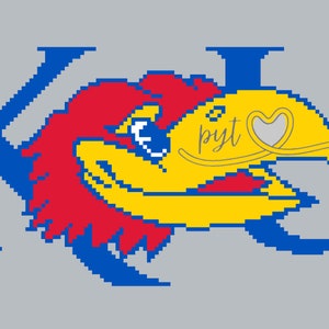 May include: A blue and yellow pixelated image of the KU Jayhawk mascot with the letters "KU" on either side. The Jayhawk has a red crest and a white heart with the word "pyt" written on it.