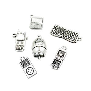 May include: Six silver charm pendants with various computer and phone designs. The charms include a laptop, a keyboard, a computer mouse, a cell phone, and a flip phone.