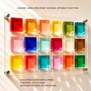 May include: A clear acrylic panel featuring 18 colourful blocks arranged in rows. Each block is 7.6 x 7.6 x 2.5 cm and has a coloured back. The text at the top says "CHOOSE 'JEWEL SPECTRUM' ON PANEL OPTIONS TO BUY THIS."
