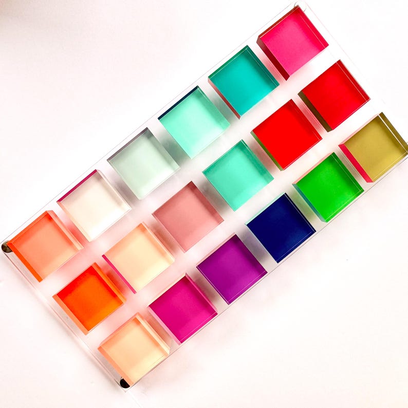 May include: A clear acrylic tray with 16 colorful square compartments. The compartments are filled with different shades of pink, red, orange, yellow, green, blue, and purple.