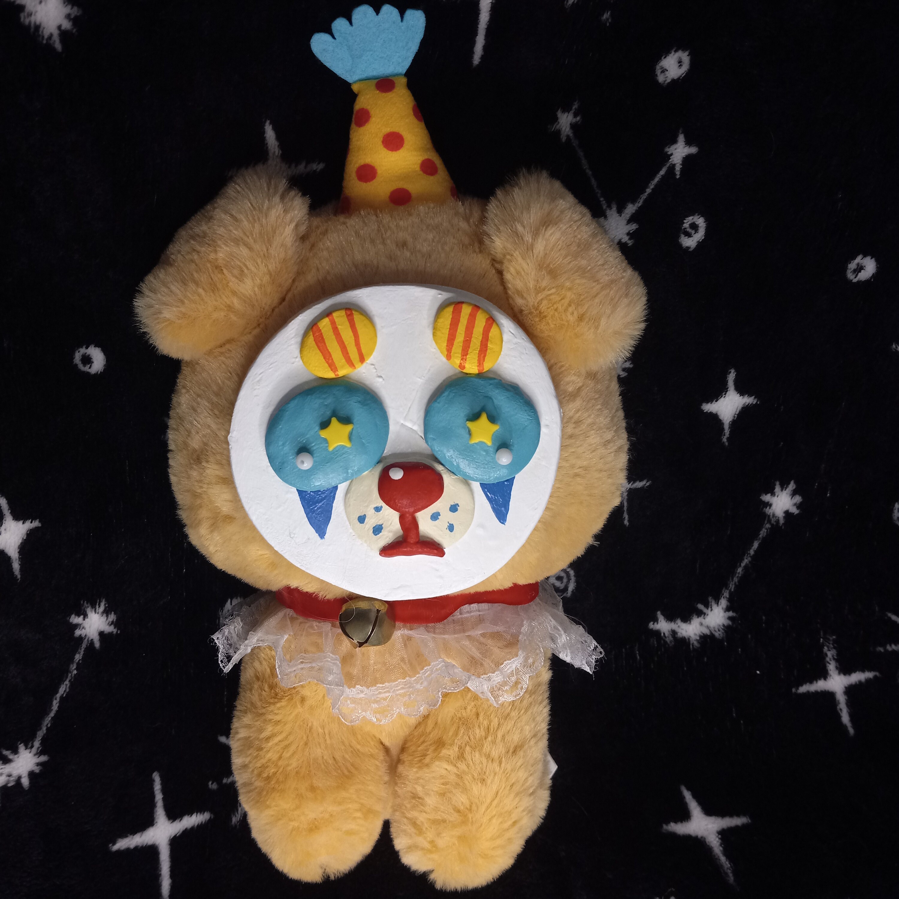 stuffed animals with clay faces