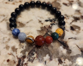 solar gemstone bracelet with all the planets perfect for the solar eclipse
