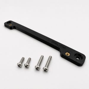 May include: A black, elongated mounting bracket featuring the embossed text "CWLJDM" and two integrated brass-colored threaded inserts. The bracket is accompanied by four silver-colored metal screws with rounded heads and hex sockets.