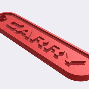 May include: Red plastic keychain with the word "CARRY" embossed on it.