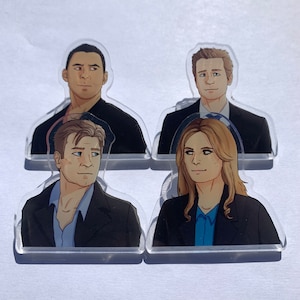 May include: Four clear acrylic character cutouts. Each cutout features a different illustration of a person wearing a suit jacket and a collared shirt. The illustrations are in a cartoon style, with detailed facial features and hair.