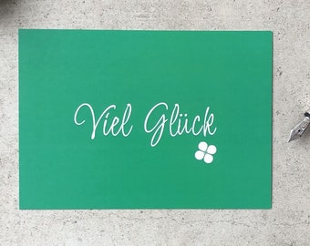 Postkarte "Viel Glück". Deine Grußkarte für Deine persönliche Glücksbotschaft zu vielen Anlässen. Einschulung, Mutig sein, Daumen drücken.