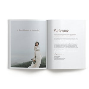 May include: An open book with a quote about flowers and a welcome message from Fleur Studio, a family-owned and operated floral design company located in Long Beach, California. The book features a photo of a bride in a white dress standing in a foggy landscape.