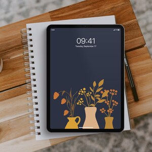 May include: A digital tablet with a dark blue background and a floral design. The time is 09:41 and the date is Tuesday, September 17.