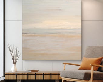 May include: Abstract landscape painting with horizontal brushstrokes in beige, cream, and pale blue hues. The artwork hangs above a wooden cabinet and a gray armchair with an orange pillow. The painting evokes a serene, coastal scene.