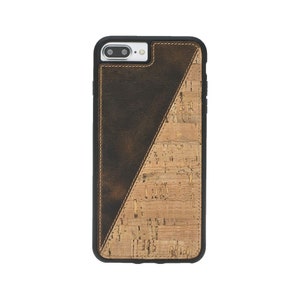 May include: A brown leather and cork phone case with a geometric design. The case has a black border and a camera cutout.