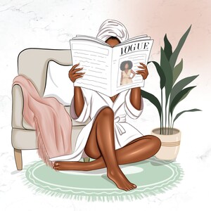 May include: A woman in a white robe and a towel on her head is sitting on a rug and reading a magazine called "VOGUE".
