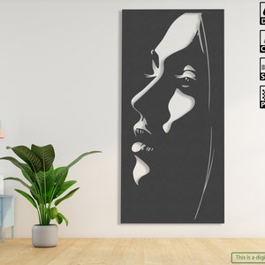 Peut inclure: Une illustration numérique en noir et blanc d'un visage de femme avec une longue chevelure fluide. L'image est de style minimaliste et convient à une utilisation en téléchargement numérique pour des projets d'artisanat.