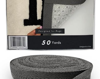 May include: A roll of gray and black twill tape with a herringbone pattern. The packaging reads "DABLINE Twill Tape" and "Designed for Rugs". The tape is 1.5" wide and comes in a 50-yard roll. The product is made of 70% cotton and 30% polyester.