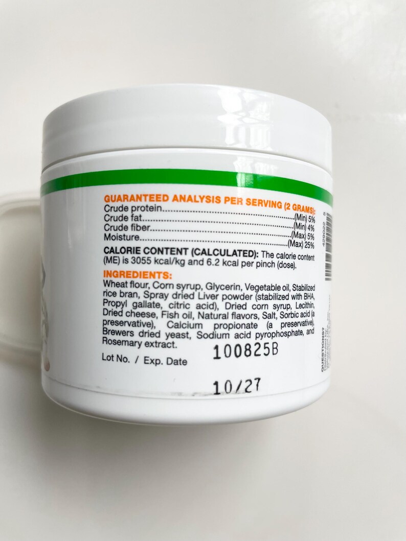 May include: A white ceramic mug with a black handle and the text "But First, Coffee" in a bold, black font. The mug is set against a neutral background, highlighting its simple design.