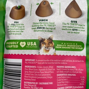 May include: Green bag of cat treats, Pill Pockets, with instructions: Fill, Pinch, and Give. The bag features a cat illustration and text about the product's features and ingredients. The treats are designed to help cats take medicine.