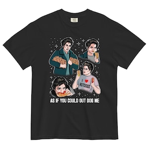 May include: Black t-shirt featuring a graphic of a person eating hot dogs in four different poses. The shirt includes the text "I ❤️ HOTDOGS" and "AS IF YOU COULD OUT DOG ME."